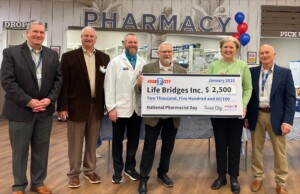 Food City presents a check to Life Bridges Inc. of Cleveland.